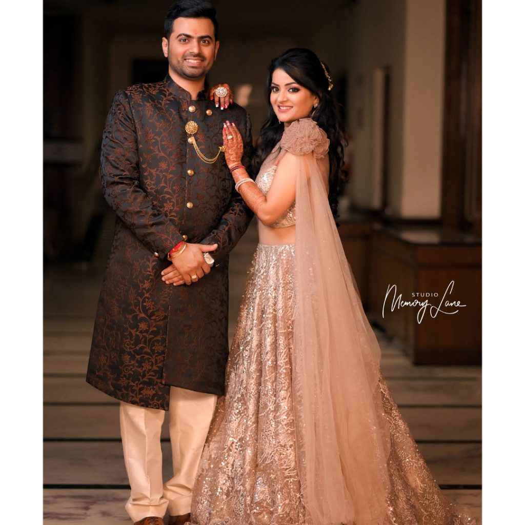 Photo of A sikh couple poses after their wedding