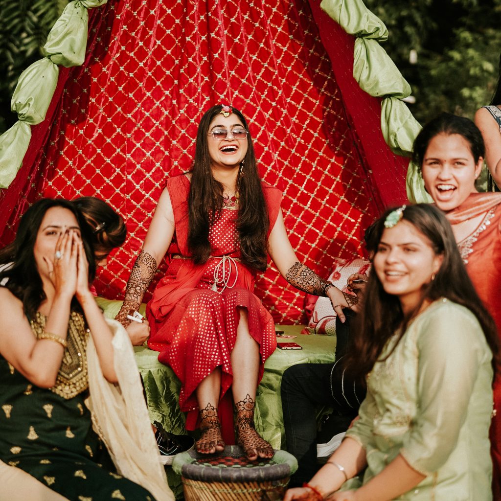 Candid Photography- Bride having the best time with her bride-maids on her Mehandi Ceremony.