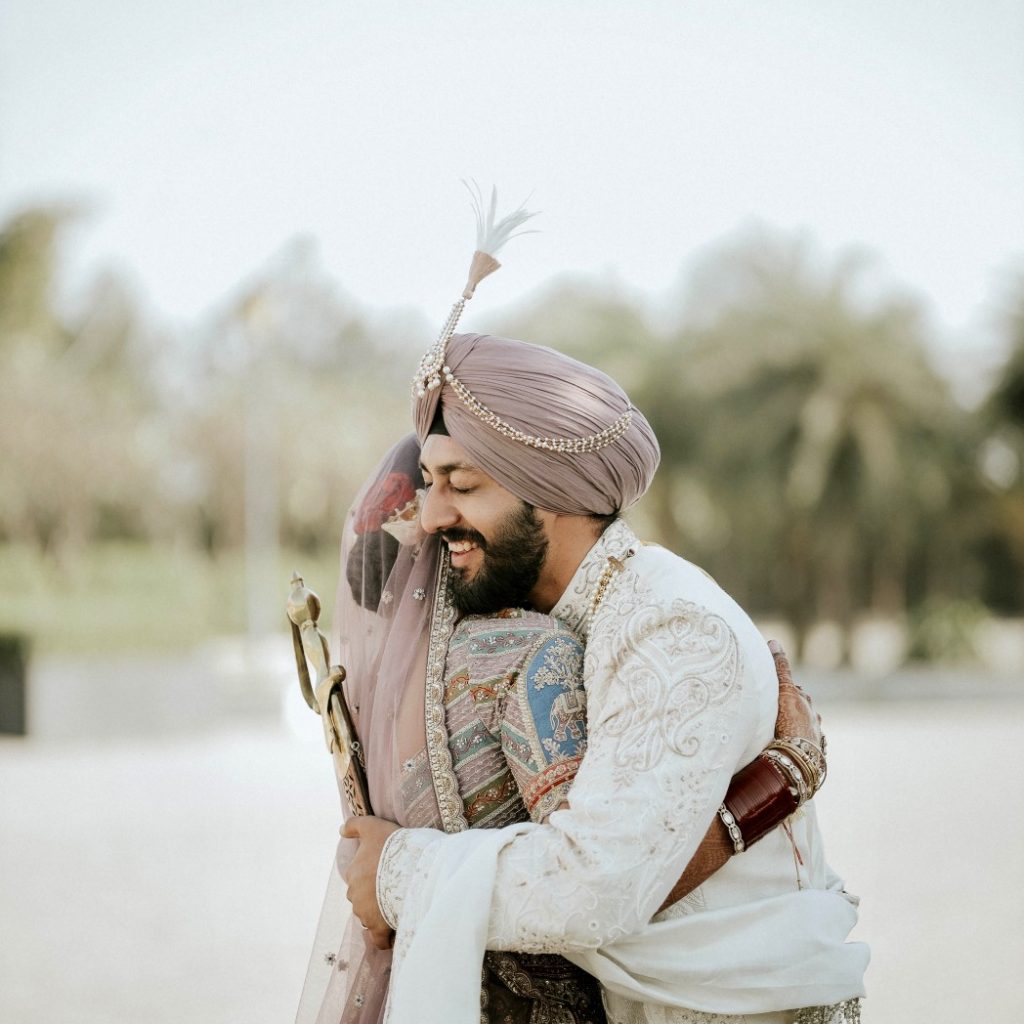 College friends turned into a loving couple- Couple hugging each other on their wedding day 