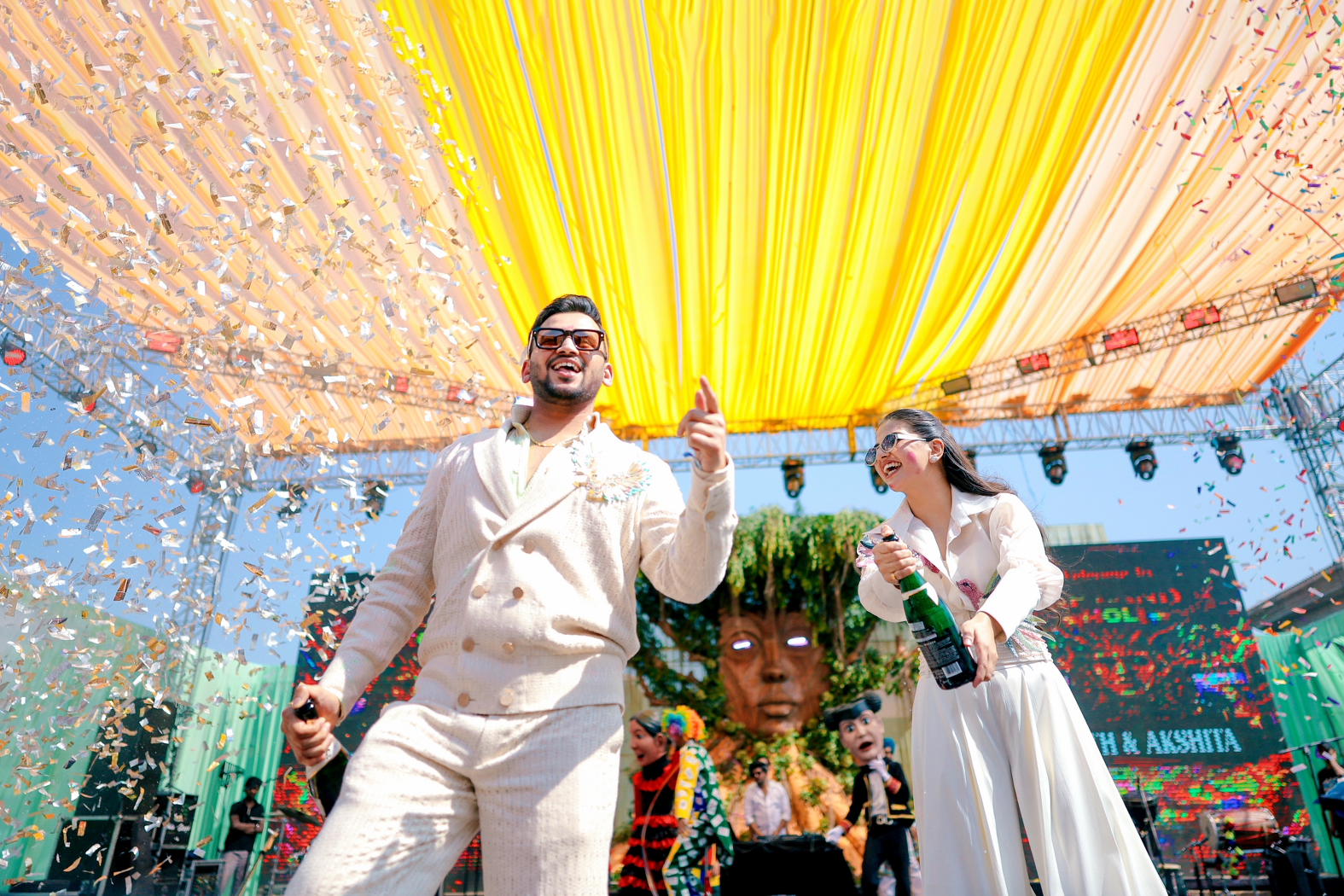 candid moment from the holi carnival from the stage poping champagne