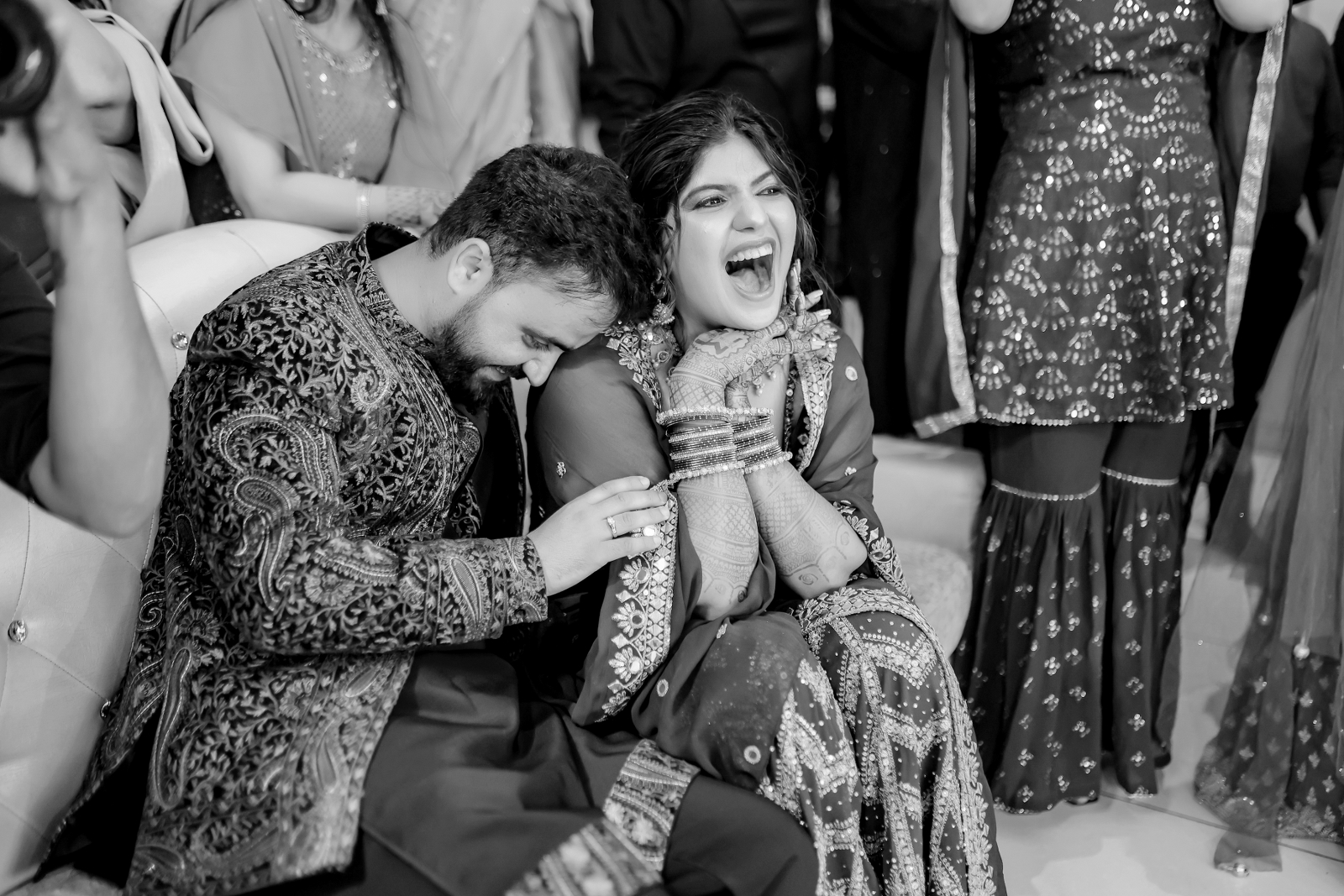 Candid shot of couple laughing during their wedding festivities