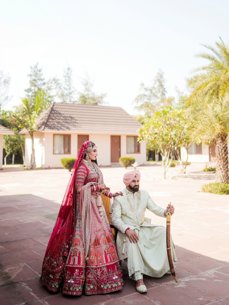 sikh bride and groom in an editorial portrait in their royal outfits